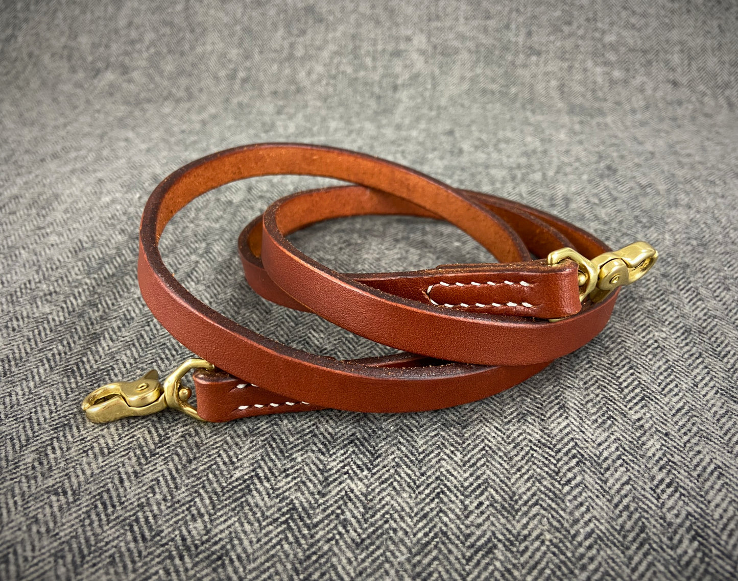 Handcrafted full grain vegetable tanned leather crossbody purse strap made in New Hampshire, USA. Fully hand stitched, solid brass hardware, hand burnished edges.