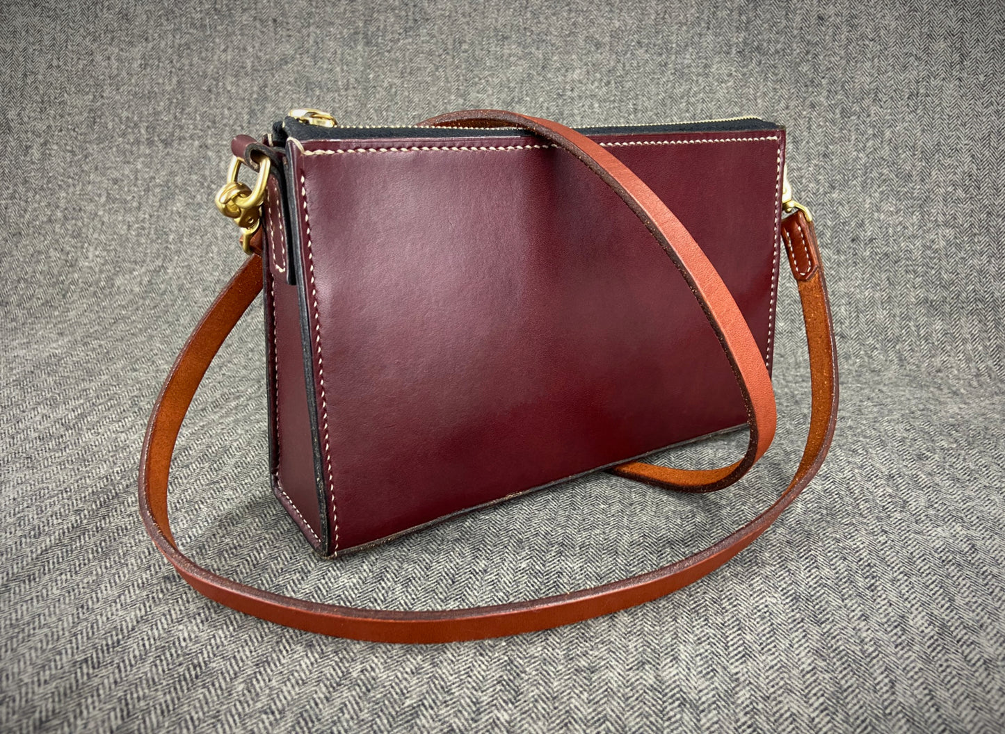 Handcrafted full grain vegetable tanned leather crossbody purse strap made in New Hampshire, USA. Fully hand stitched, solid brass hardware, hand burnished edges.